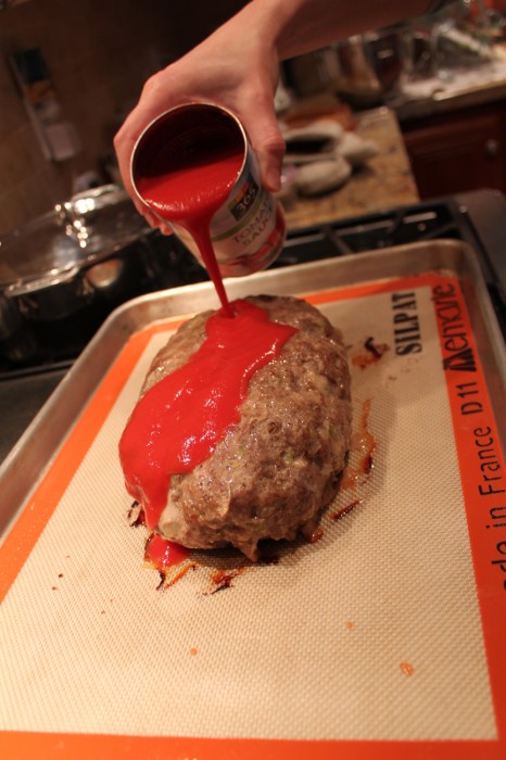 pouring the tomato sauce